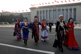 Women delegates in ethnic minority costumes leave the Great Hall of the People following the opening session of the Chinese People's Political Consultative Conference (CPPCC) in Beijing, China, on March 4, 2023. REUTERS/Thomas Peter