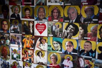 A portion of a mural, which displays images of people who have died of COVID-19, is seen in Joni Zavitsanos' art studio, in Houston, Texas, on June 10, 2021.