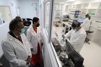 World Health Organization Director-General Tedros Adhanom Ghebreyesus and Belgium's Minister of Development Cooperation Meryame Kitir visit a WHO-backed mRNA vaccine hub, in Cape Town, South Africa, on February 11, 2022. REUTERS/Shelley Christians