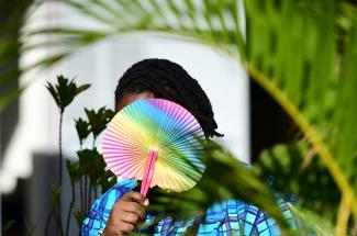 Ashley Karungi, part of the LBGTQI+ community and a single mother of two, poses outside of Rella Women's Empowerment Program for LGBTQ rights advocacy, in Kulambiro, Kampala, Uganda, on April 4, 2023. 