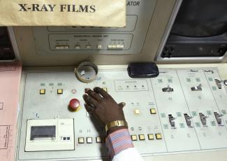 Radiotherapist Enock Okine operates a radiotherapy simulator at the Korle Bu Teaching Hospital in Accra, Ghana, on April 24, 2012. 