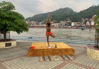India's yoga guru Baba Ramdev performs yoga on the banks of the river Ganges ahead of International Yoga day, in the northern town of Haridwar, India, on June 19, 2020. 