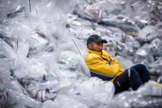 A worker sits among bags with ballots as they are being prepared to be sent from a warehouse to polling stations, ahead of the primary election, in Buenos Aires, Argentina, August 12, 2023. 
