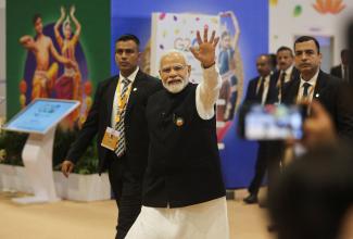 Indian Prime Minister Narendra Modi waves as he visits International Media Center, on the second day of the G20 summit in New Delhi, India,