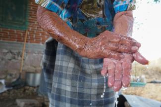 Zapotec woman washes her hands during the COVID-19 pandemic in Oaxaca state, Mexico, on March 31, 2020.