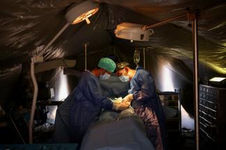 Doctors operate on an earthquake survivor at a field military hospital, in the aftermath of a deadly earthquake, in Asni, Morocco, September 13, 2023.