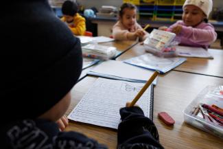 Elementary school students practice making letters in Artesia, California, U.S.
