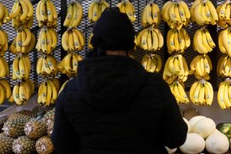 A person shops in a supermarket selling fruit and vegetables in Manhattan, New York City, on March 28, 2022