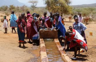 Traditional Maasai women collect water from a borehole, at the Lositeti village, in Matapato North, Kajiado County, Kenya, on February 26, 2023. 