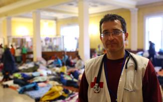 Andrea Sakhaltuyev is seen at a train station that is used as a makeshift first aid station and camp for women and children who fled the ongoing Russian invasion.