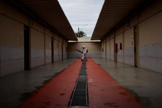 A health worker sprays insecticide to kill the Aedes aegypti mosquitos to help mitigate a dengue outbreak at a public school in Brasilia, Brazil February 16, 2024.