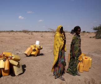 Women wait to collect water in the drought stricken Somali region.