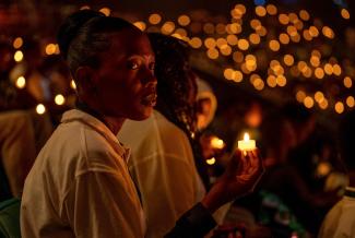 Participants hold a candlelight night vigil during a commemoration event, as Rwanda marks the 30th anniversary of the 1994 Genocide, in Kigali, Rwanda, on April 7, 2024.