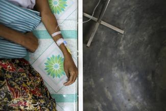 A HIV-positive patient receives medicine through an intravenous drip at Doctors Without Borders Holland's clinic in Yangon, Myanmar, March 3, 2014.