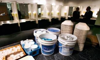 Supplies including syringes, bandaids and antiseptic pads wait to be used inside a safe injection site.
