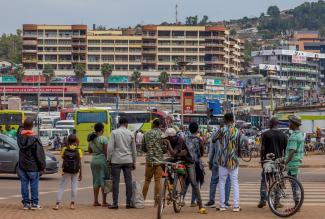 Pedestrians wait to cross a street in Kigali, Rwanda, April 26, 2024.