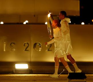 Alexis Hanquinquant of France and Nantenin Keita of France  prepare to light the cauldron during the opening ceremony of the Paris 2024 Paralympics