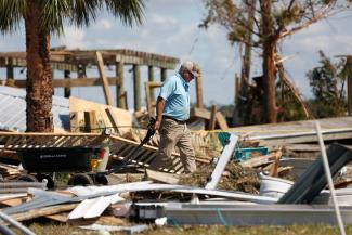 A resident of Keaton Beach works to recover their belongings from their home after Hurricane Helene passed through the Florida panhandle.