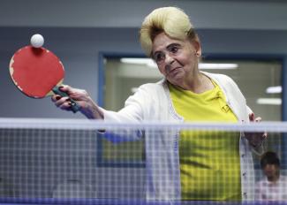 Holocaust survivor Betty Stein, 92, plays ping pong at a program for people with Alzheimer's and dementia at the Arthur Gilbert table tennis center in Los Angeles, California, on June 15, 2011. 