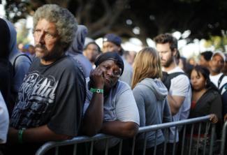 People wait for an exam at the Care Harbor/LA free clinic that provides free dental work, medical exams, screenings and immunizations.