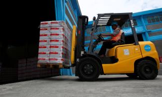 A worker transports therapeutic food in a United Nations International Children's Emergency Fund warehouse, in Addis Ababa, Ethiopia, on April 22, 2016.