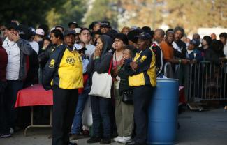 People wait in line at the Care Harbor/LA free clinic in Los Angeles, California, on September 27, 2012. 