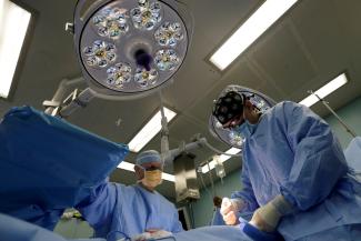 A medical team performs an inguinal hernia surgery, in an operating room on U.S. Navy hospital ship the USNS Comfort, off the coast of Riohacha, Colombia, on November 27, 2018.