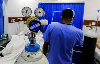 A health-care worker attends to a patient with COVID-19 inside the Intensive Care Unit, at the Care Hospital, in Nairobi, Kenya, on August 4, 2021.