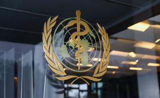 The World Health Organization (WHO) logo is pictured at the entrance of the WHO building, in Geneva, Switzerland, on December 20, 2021.