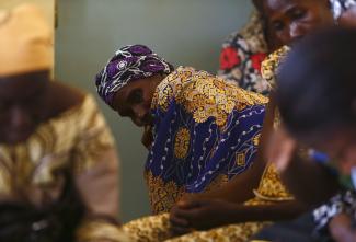 Women attend a talk on sexual health and HIV prevention organised by the Jesuit-founded Association Solidarite Vie e Santa (ASVS - Association of Solidarity, Life and Health) at their welcome centre and clinic in the Tanghin neighbourhood of Ouagadougou April 13, 2013