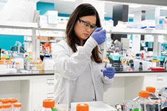 Research assistant Marion Hong, of RNA medicines company Arcturus Therapeutics, conducts research on a vaccine for COVID-19, in San Diego, California, on March 17, 2020. 