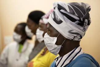 Patients with HIV and tuberculosis (TB) wear masks while awaiting consultation at a clinic in Cape Town, South Africa, on February 23, 2010.