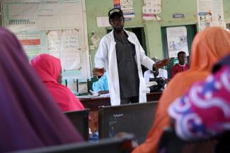 Kabir Musa, Officer in Charge at Tudun Gambo Primary Health Care Center, speaks to nursing mothers whose children are malnourished, following aid cuts, in Tudun Gambo, Nigeria, on May 8, 2025.