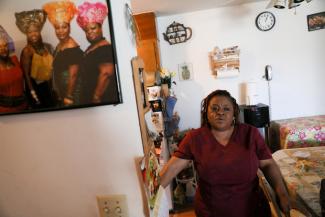Deferred Enforced Departure status holder Marie Zar, who works as a nurse’s assistant, gets ready for work, in Brooklyn Center, Minnesota, on March 29, 2019.