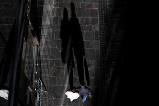 Shadows of shoppers are seen, after new nationwide restrictions were announced during the COVID-19 outbreak, in Bristol, Britain, on November 4, 2020. 