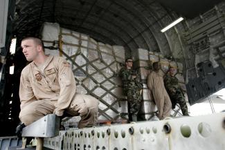 U.S. Air Force servicemen unload humanitarian aid from a U.S. military cargo plane at Tbilisi airport, in Tbilisi, Georgia, on August 14, 2008.