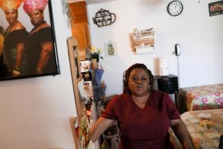 Deferred Enforced Departure status holder Marie Zar, who works as a nurse's assistant, gets ready for work, in Brooklyn Center, Minnesota, on March 29, 2019.