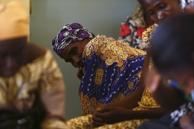 Women attend a talk on sexual health and HIV prevention organised by the Jesuit-founded Association Solidarite Vie e Santa (ASVS - Association of Solidarity, Life and Health) at their welcome centre and clinic in the Tanghin neighbourhood of Ouagadougou April 13, 2013