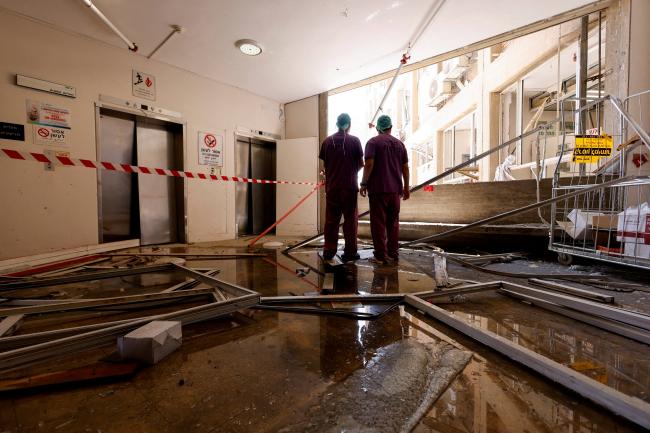 Medical staff inspect the damage at an impact site, following a missile strike from Iran on Israel, at Soroka Medical Center, in Beersheba, Israel, on June 19, 2025.