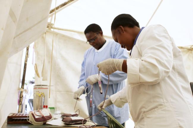 Staff label plastic bags filled with donated blood, in Nairobi, Kenya, on January 9, 2012.