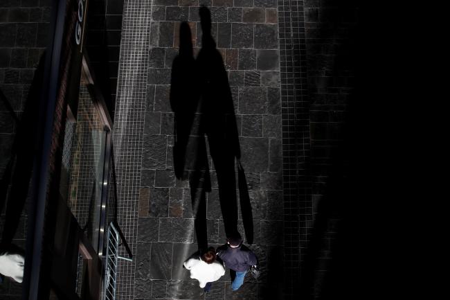 Shadows of shoppers are seen, after new nationwide restrictions were announced during the COVID-19 outbreak, in Bristol, Britain, on November 4, 2020.